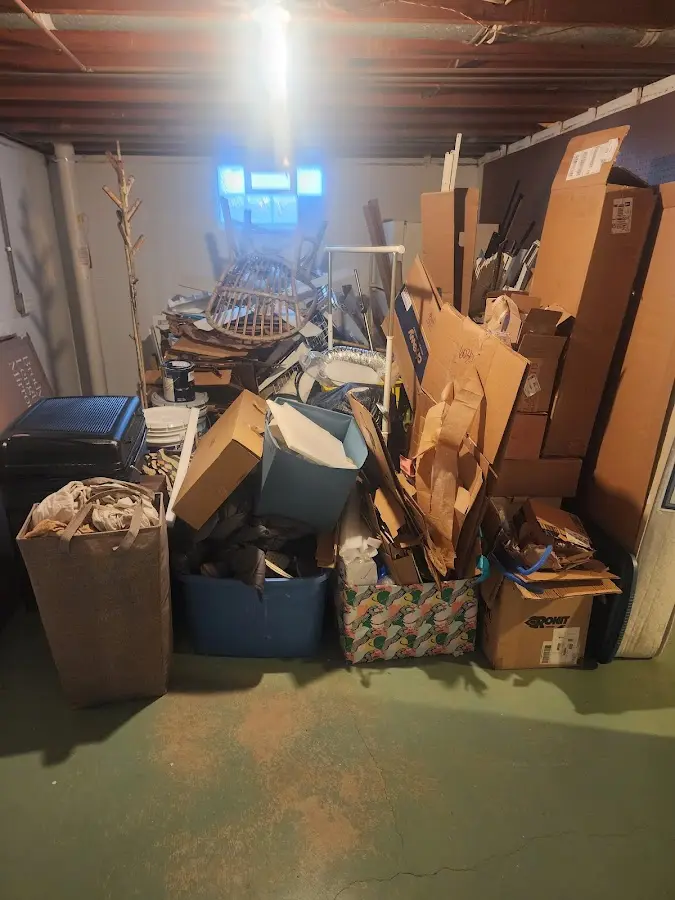 Roll-off dumpster container at job site for 2 Yard Dumpster Rental in Red Bank